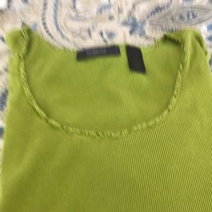 Green, sleeveless top.